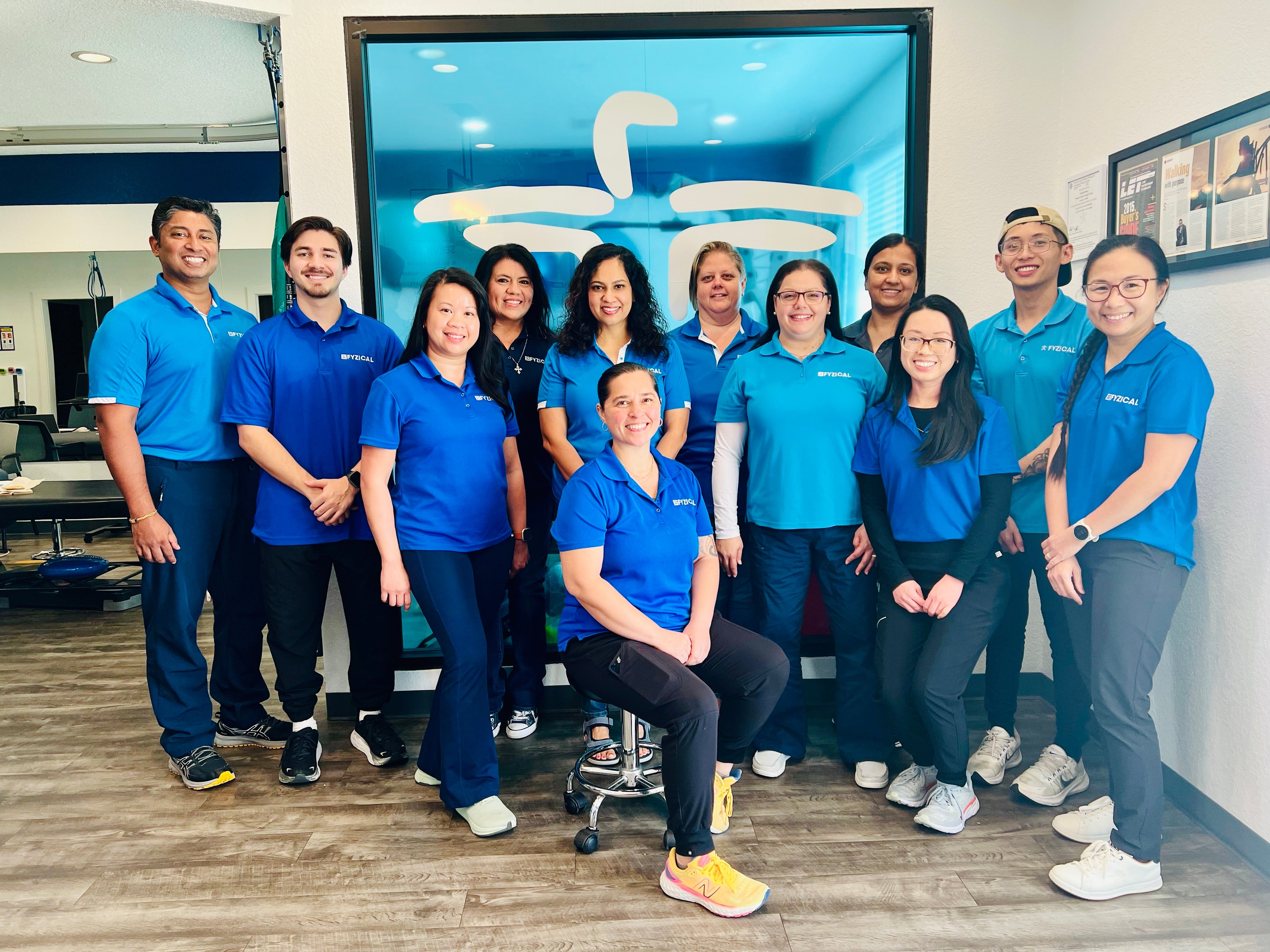 Noel Thomas, PT, and Jayne Thomas, Owners, FYZICAL Sugar Land and FYZICAL Harvest Green, Texas, with their staff.