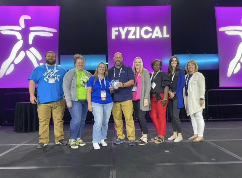 2023 FYZICAL Franchisee of the Year Jerry Yarborough, PT, DPT Master Franchisee and his team at FYZICAL Therapy & Balance Center's Brand Triumph.